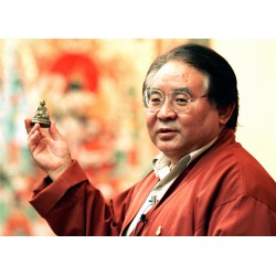 Sogyal Rinpoche holding...